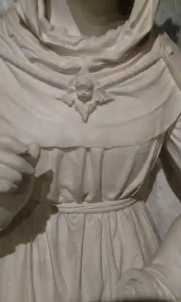 Mother and child statue, angel in a cross on chest of woman